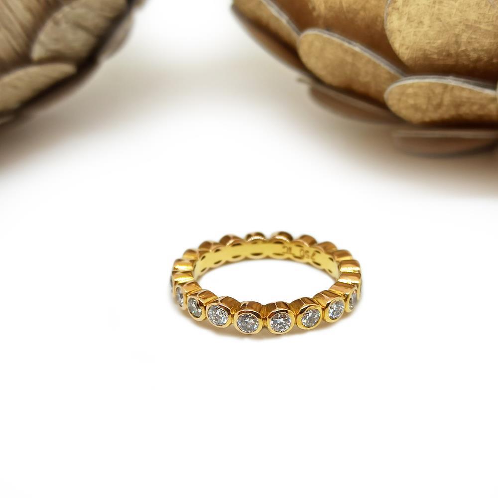 Alianza de oro amarillo 18cts con diamantes talla brillante 20 brillantes de 0.06cts.