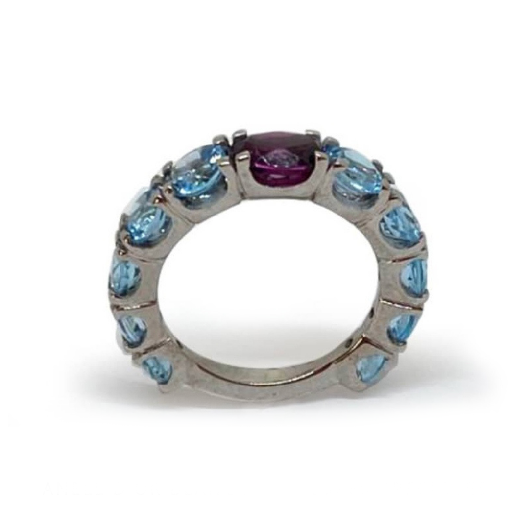ANILLO ORO BLANCO CON RODOLITA CENTRAL Y TOPACIO